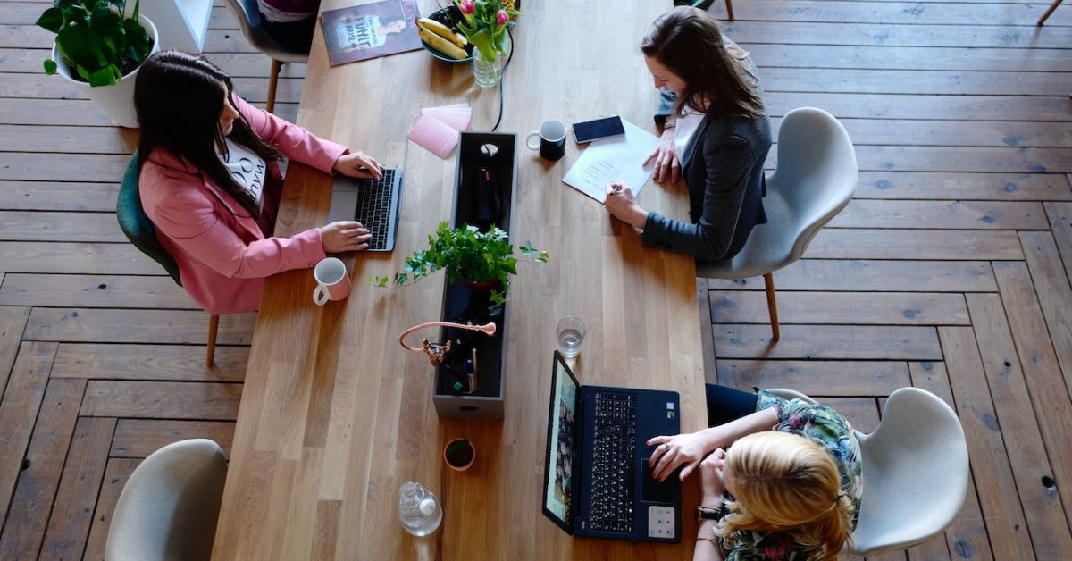 co workers working at an office table - 247 Self Storage office space in storage facilities