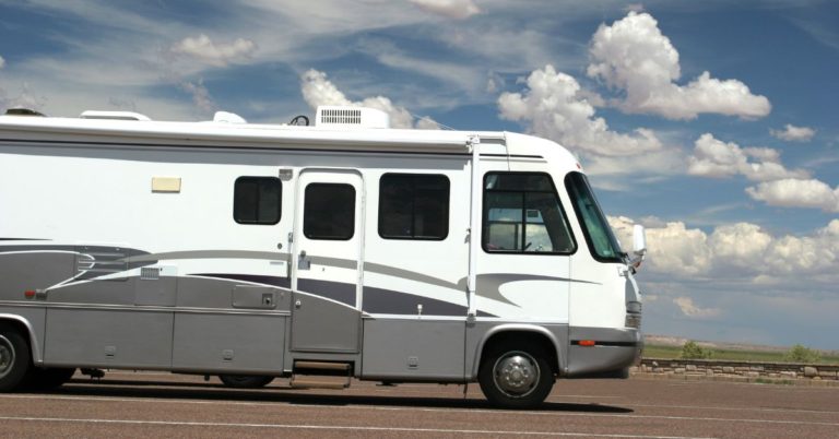 rv driving on open road and blue skies - 247 Self Storage rv storage