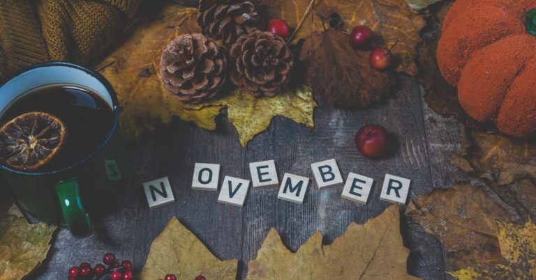 scrabble letters spelling November with fall background - 247 Self Storage self storage