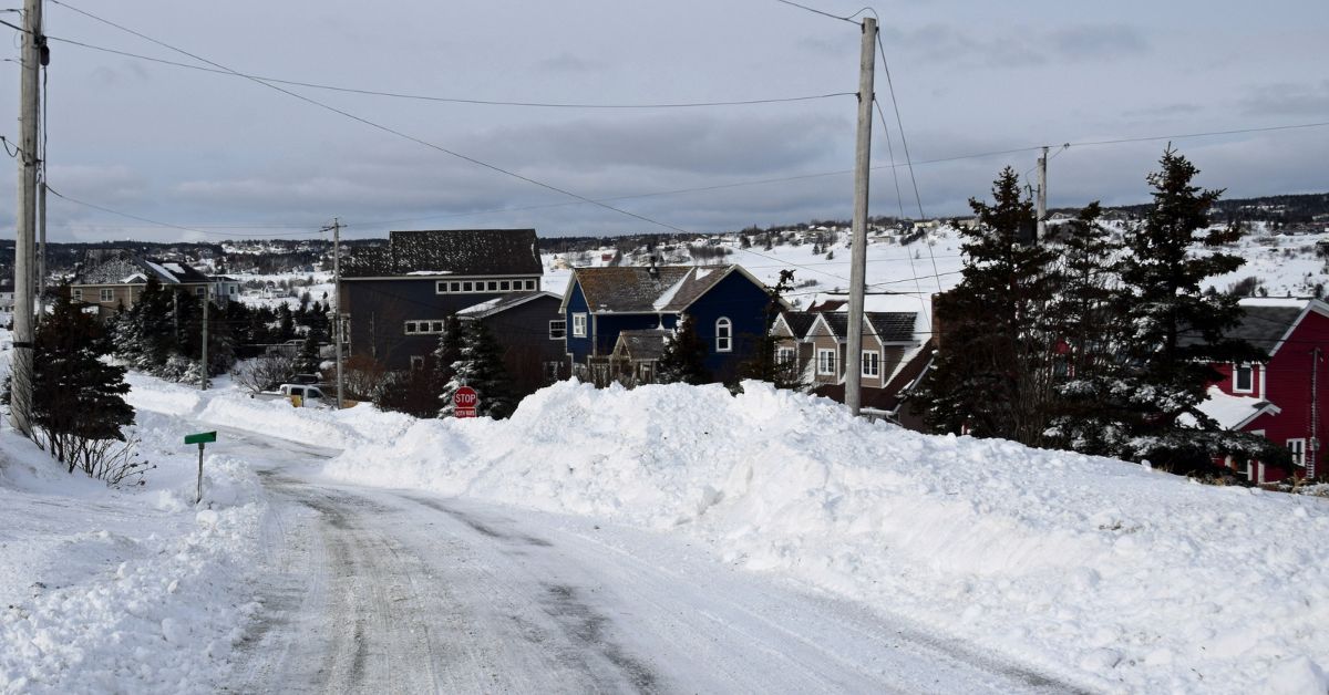 snow bank next to a neighborhood - 247 Self Storage self storage