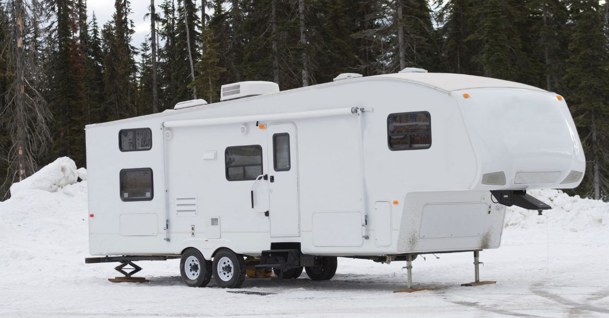 rv trailer outside in the snow - 247 Self Storage rv storage solutions